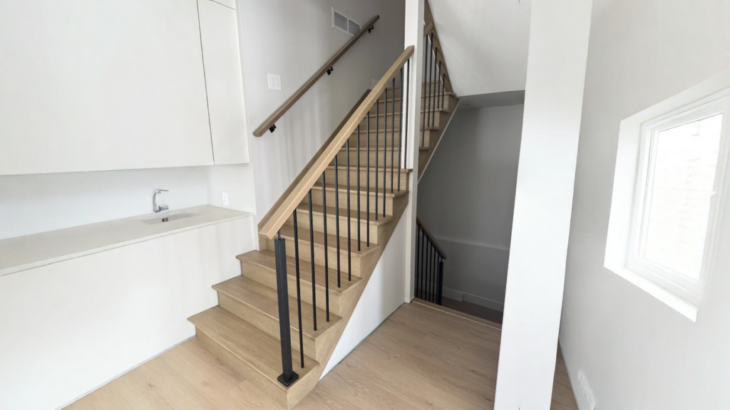 Straight staircase in white oak to balusters black steel