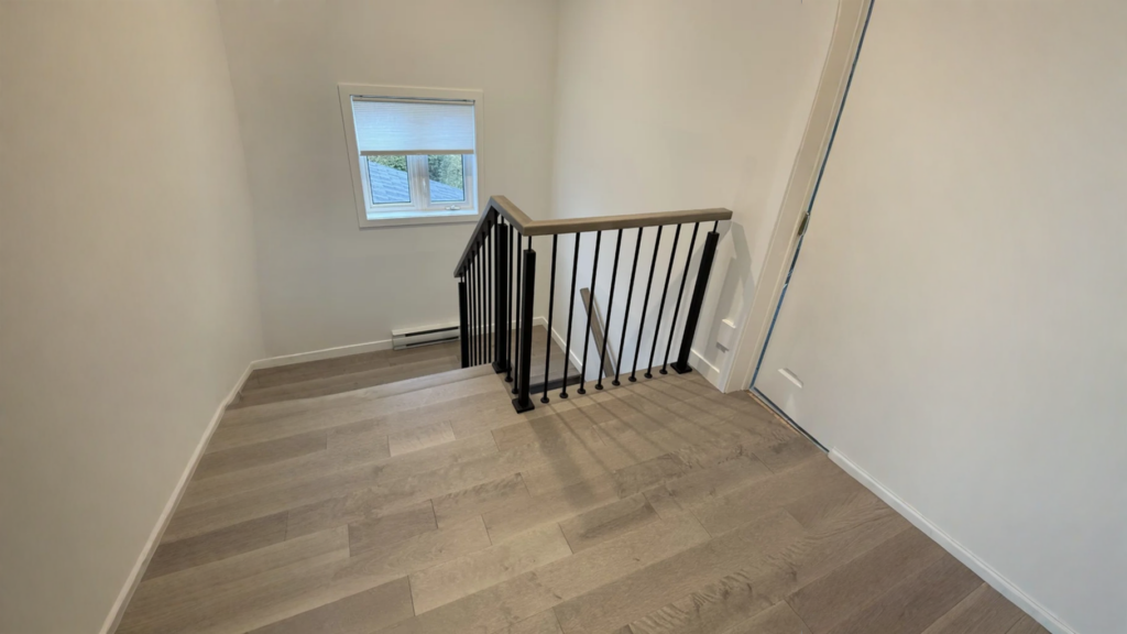 Balusters entrance staircase of black steel and floor stained gray