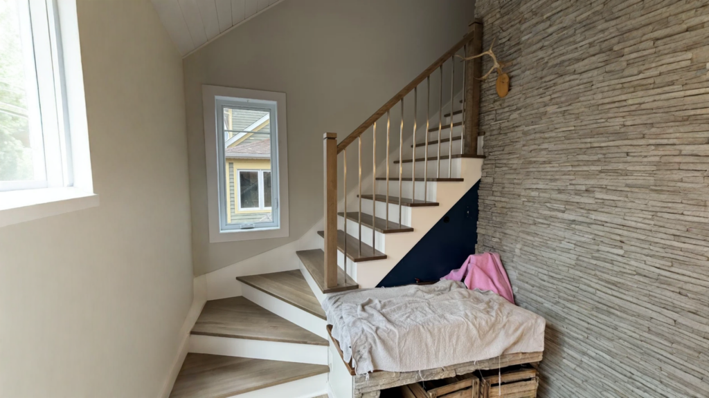 Winder wood staircase stained grey to balusters metal