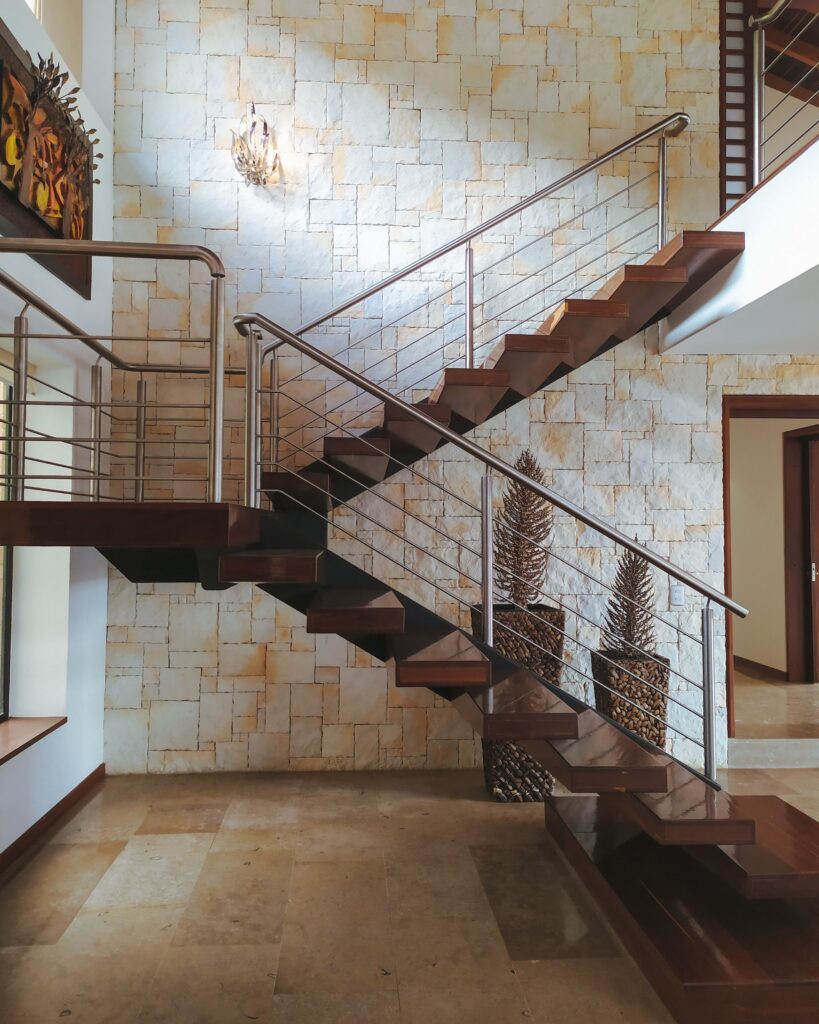 Steel stair railing to balusters on an inner fly