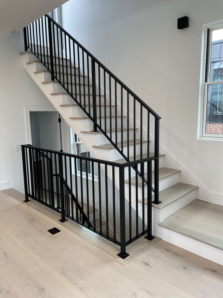 Metal stair railing custom with hardwood handrail
